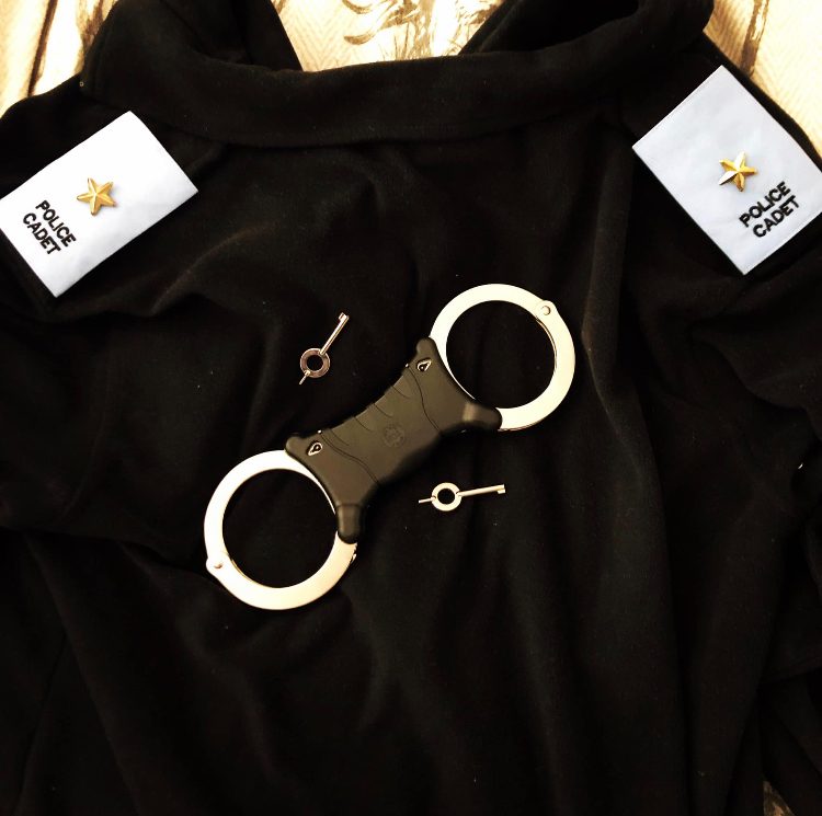 Police handcuffs and epaulettes